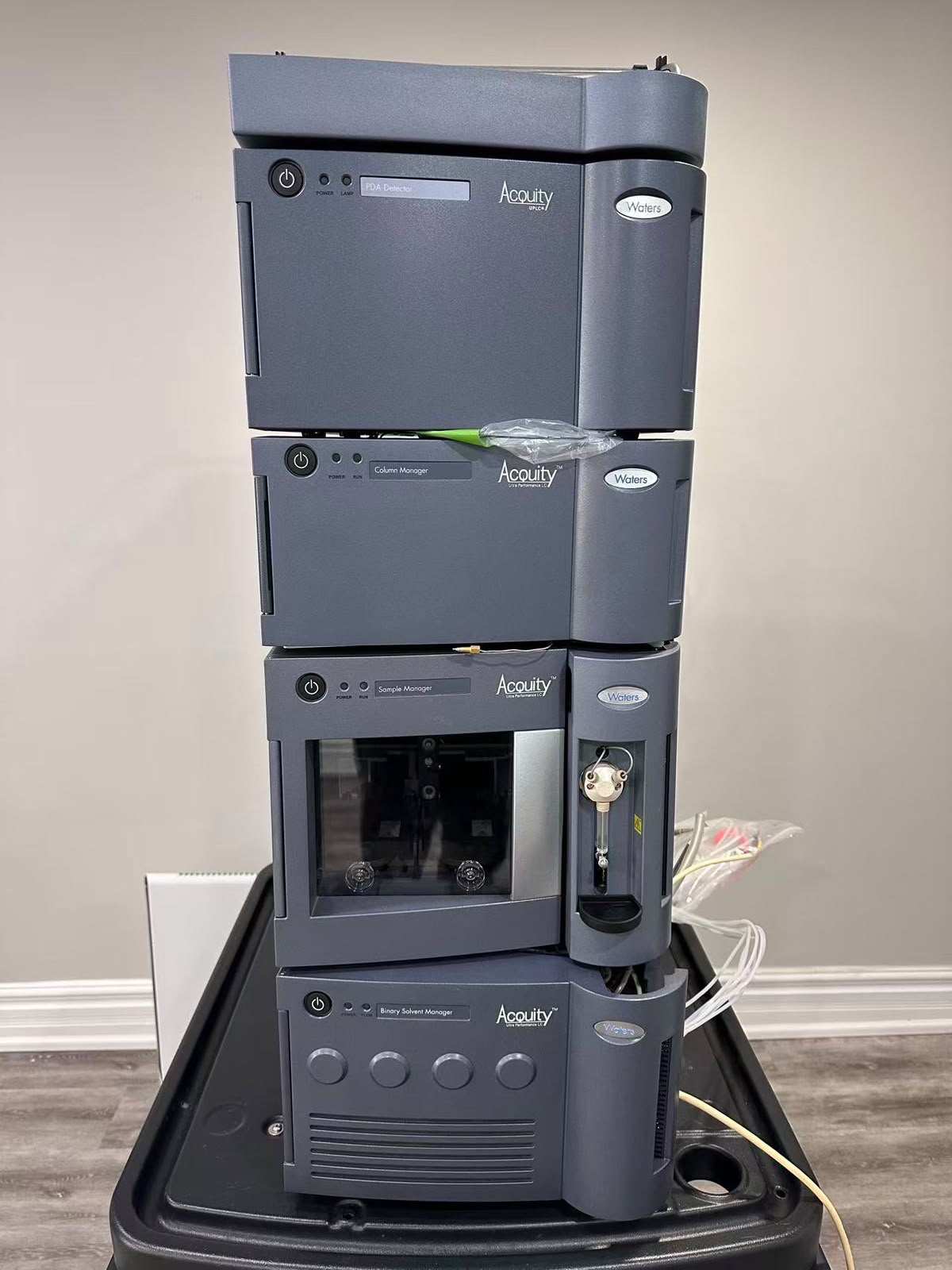 Waters ACQUITY UPLC stack: PDA detector, Column Manager, Sample Manager and Binary Solvent Manager.