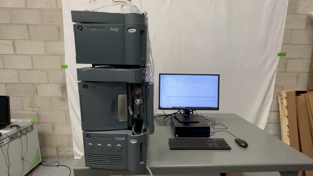 Waters ACQUITY UPLC with TUV detector, column heater, Sample Manager and Binary Solvent Manager beside its Empower PC.