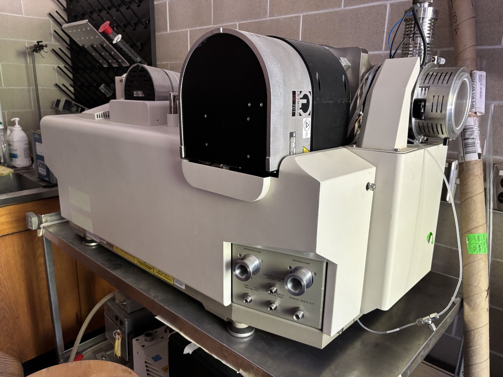 SCIEX API 4000 triple quadrupole mass spectrometer on a lab cart, with its Leybold turbo pump and backing pumps.